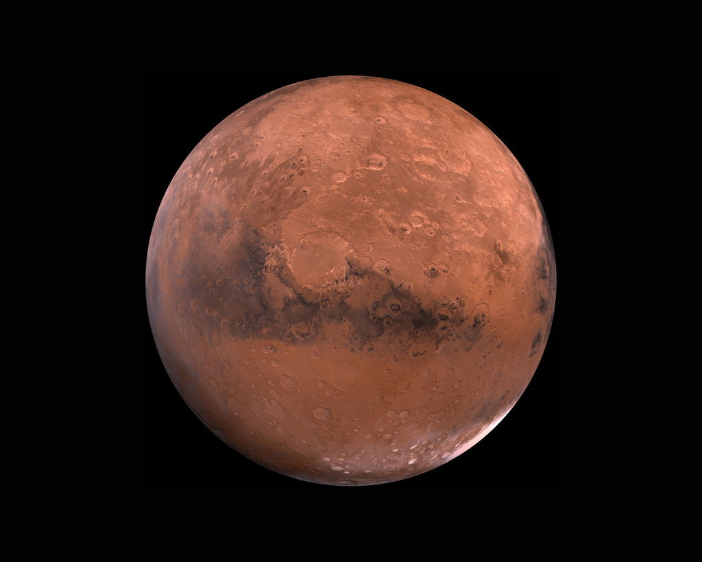 Planeta Marte com a superfície avermelhada.