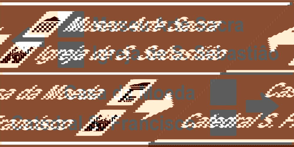 Placa de trânsito marrom de atrativos turísticos.